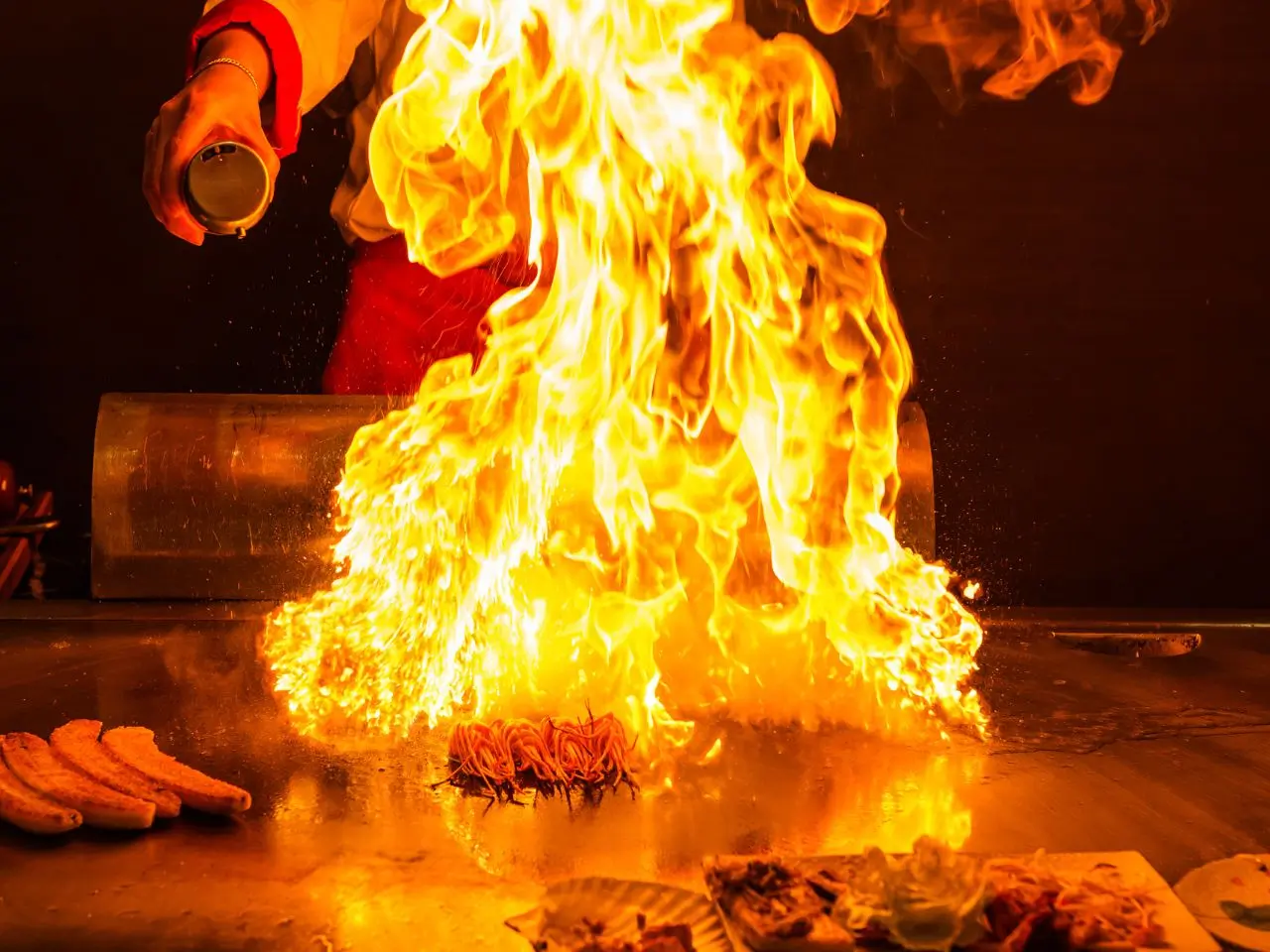 Lobster prepared with a flambé show on the teppanyaki grill at Mr Cao Japanese Steakhouse in Hutchinson