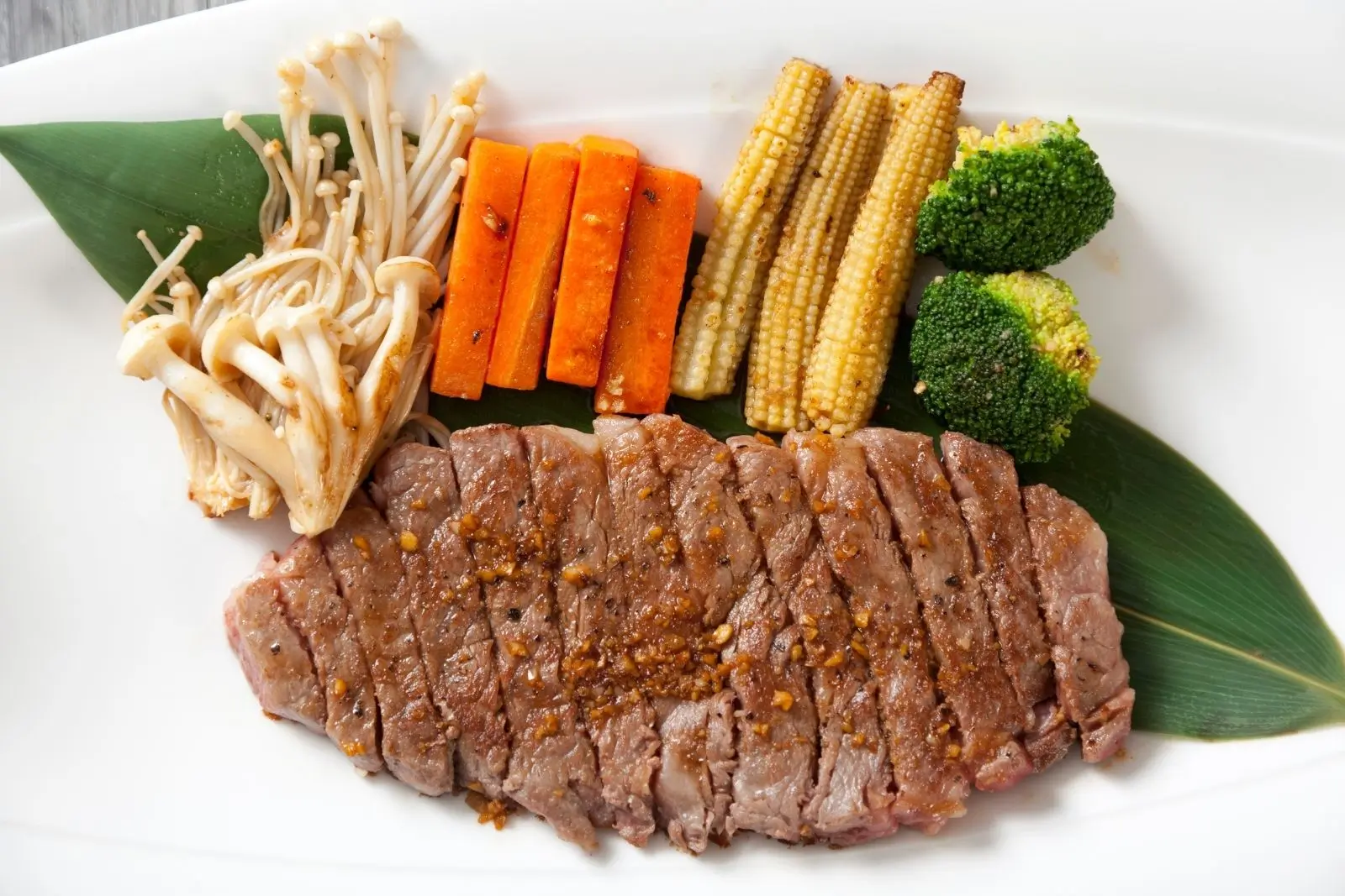 Sliced grilled beef steak with assorted vegetables at Mr Cao Japanese Steakhouse in Hutchinson